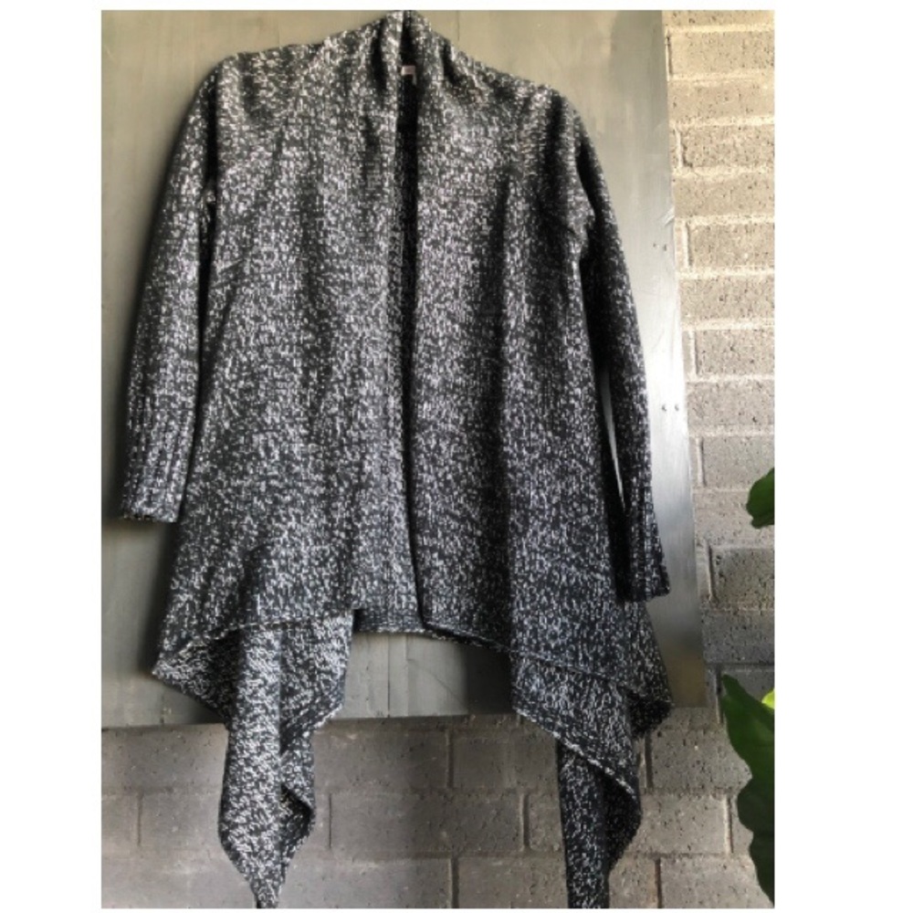 Back and white speckled sweater